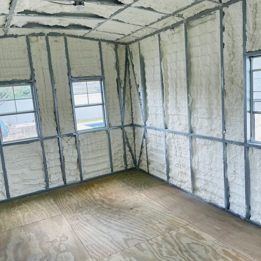Closed-cell spray foam insulation applied to wall cavities in a residential project in Bessemer